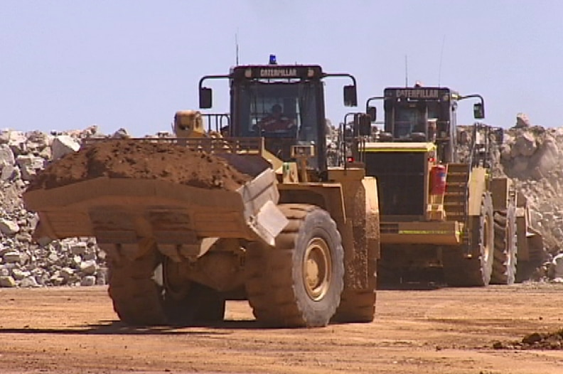 Front end loaders move dirt at the Norton mine in the Goldfields