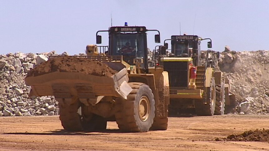 Front end loaders move dirt at the Norton mine in the Goldfields