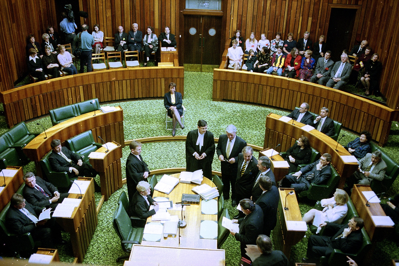 Peg Putt sits on a fold-up chair in the House Of Assembly.