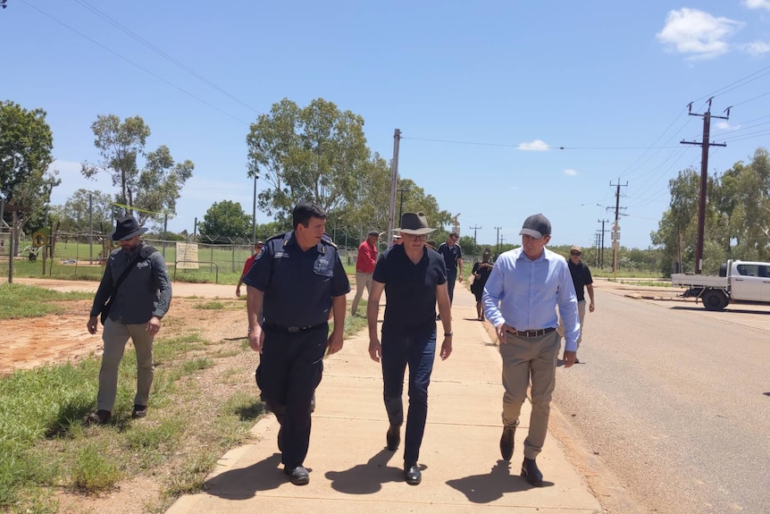 Premier Mark McGowan and Prime Minister Anthony Albanese walk the main street of Fitzroy Crossing.