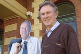 Mr Taylor stands alongside a cutout of John Bowler in Kalgoorlie this morning.