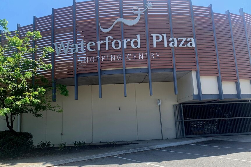 A big sign saying Waterford Plaza shopping centre