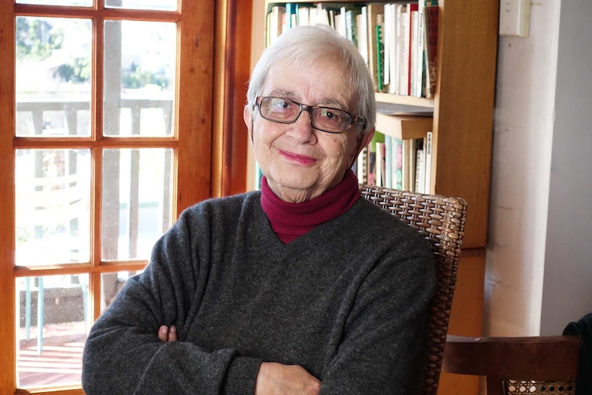 A portrait of Eva Cox in her study.