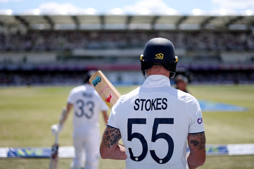 STOKES 55 can be seen on the back of Ben Stokes's shirt as he prepares to walk onto the field to bat