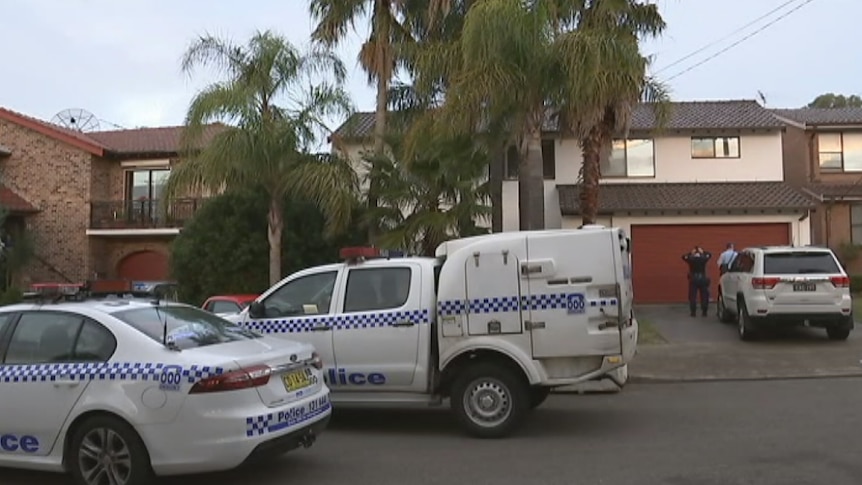 Police cars parked outside a home in Prothero Place, Pagewood