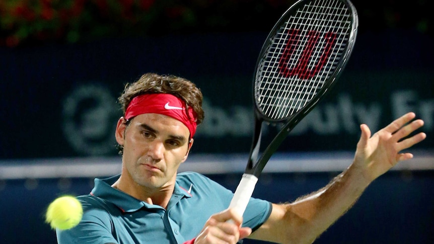 Comeback win ... Roger Federer plays a backhand return against Novak Djokovic