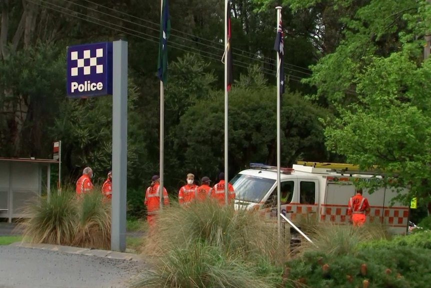 SES searchers outside a police station.