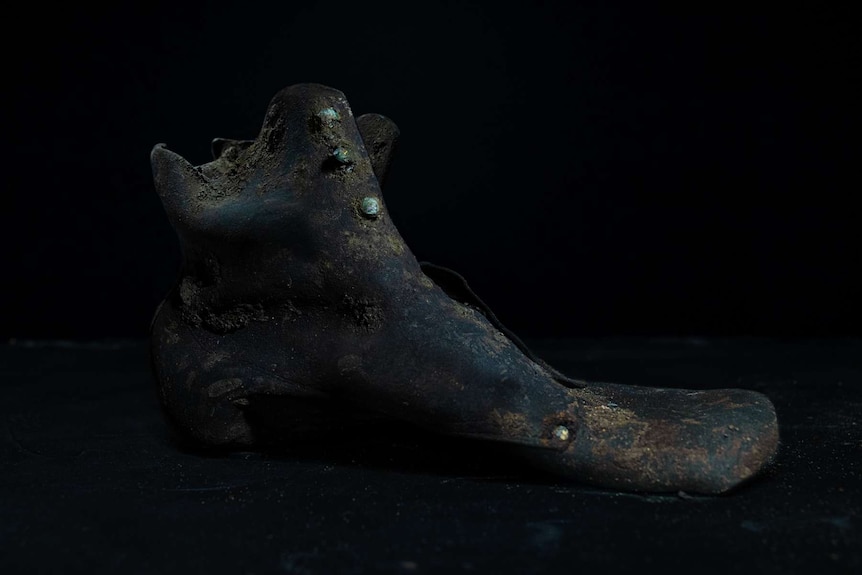 A leather boot that was preserved in mud.