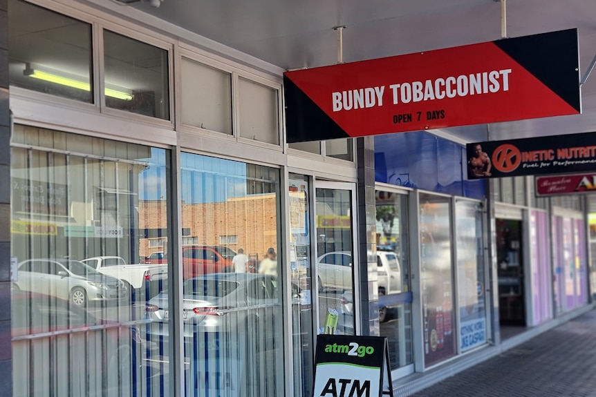 A sign saying Bundy Tobacconist outside a shop
