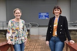 two women standing side by side