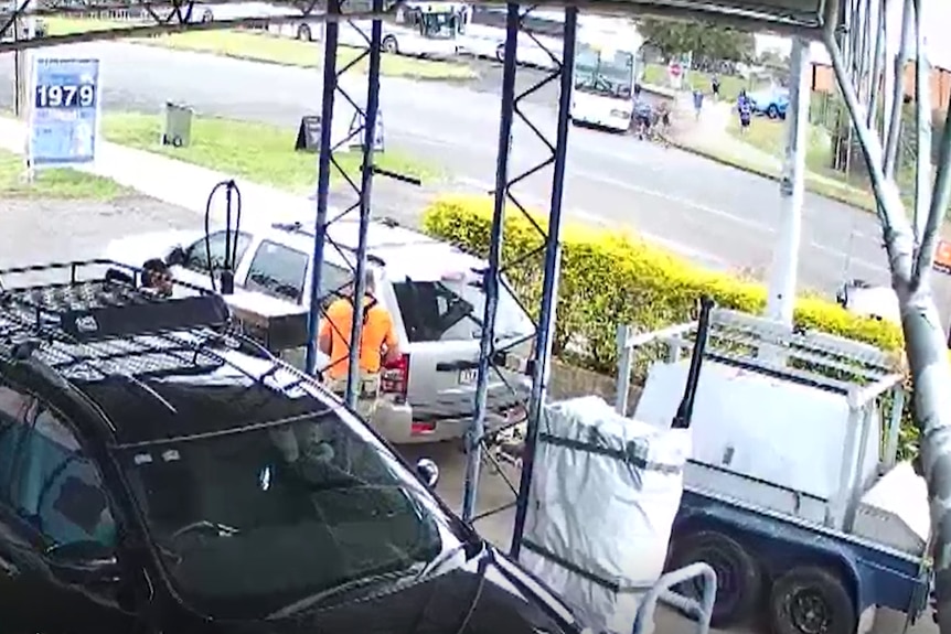 A screencap of CCTV footage showing the moment a bus started moving towards a petrol station at Casino, in NSW.