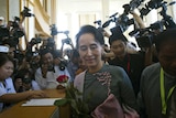 Aung San Suu Kyi arrives for Myanmar's first parliament meeting after elections