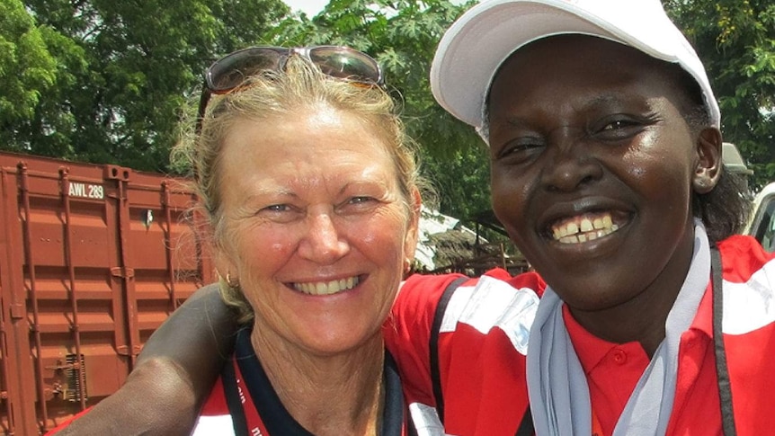 Red Cross nurse Libby Bowell working with community leaders to fight Ebola in Liberia.