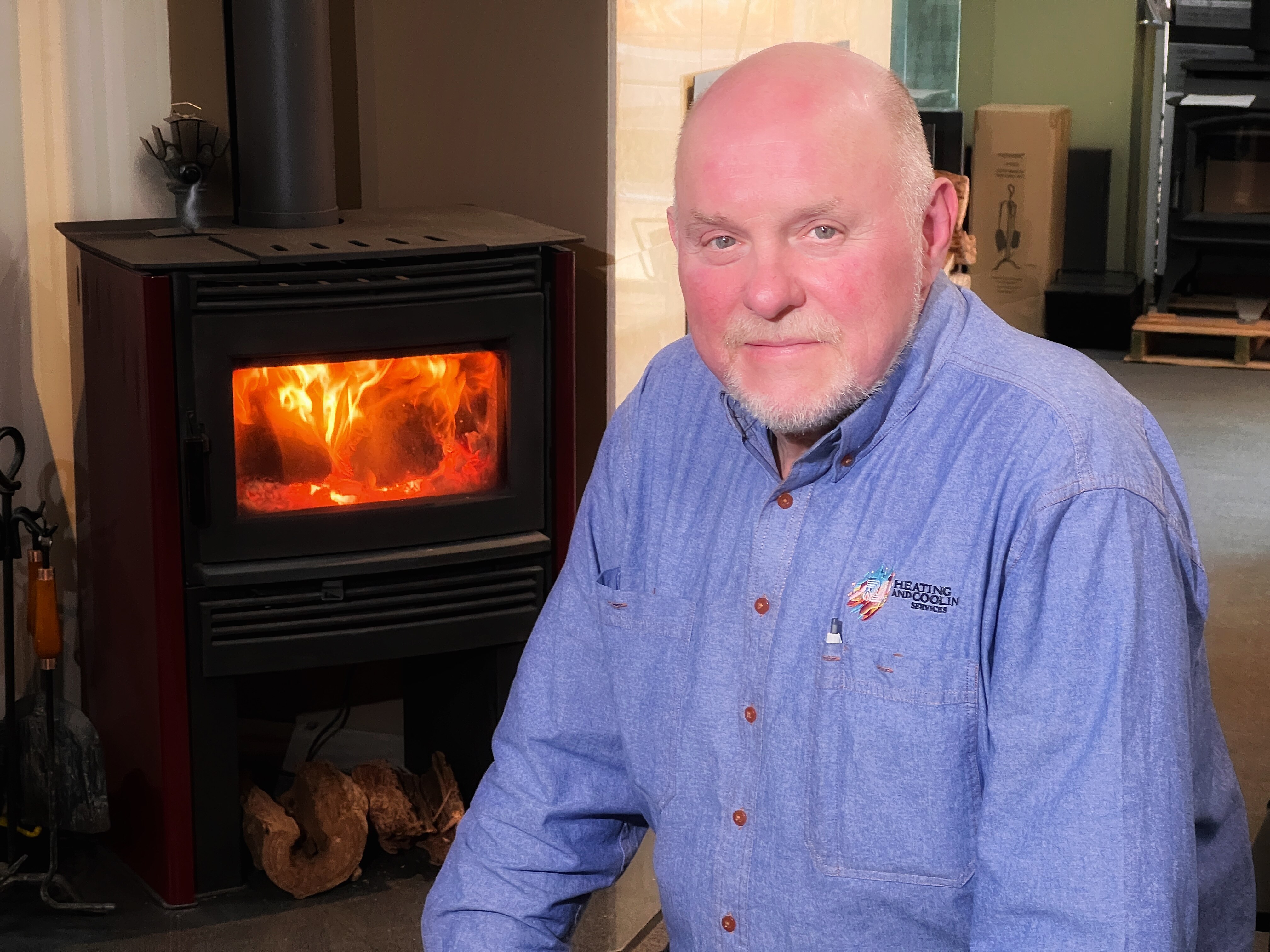 Canberra to phase out wood heaters by 2045 after report finds 'no safe