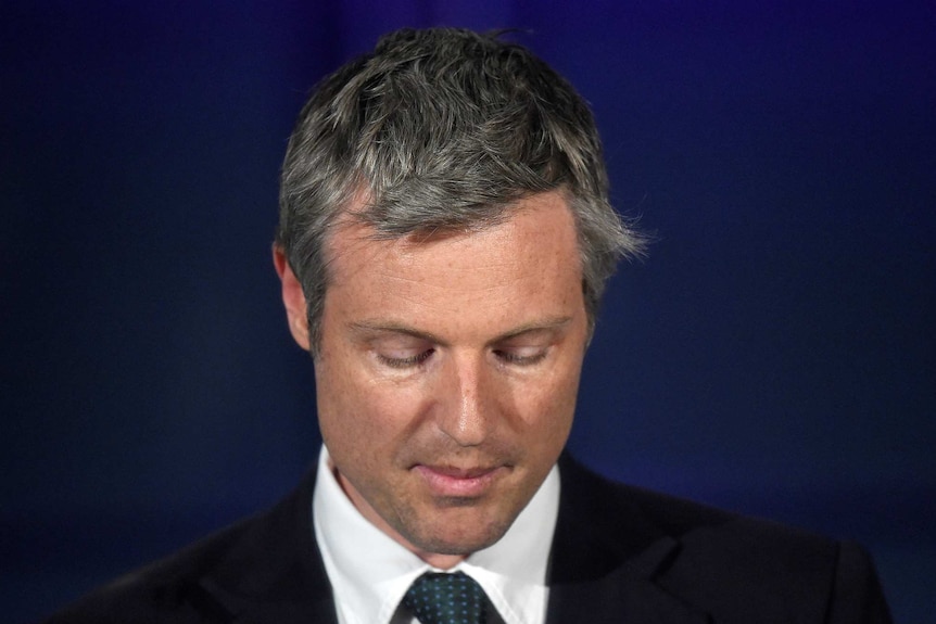 Zac Goldsmith looks dejected while speaking.