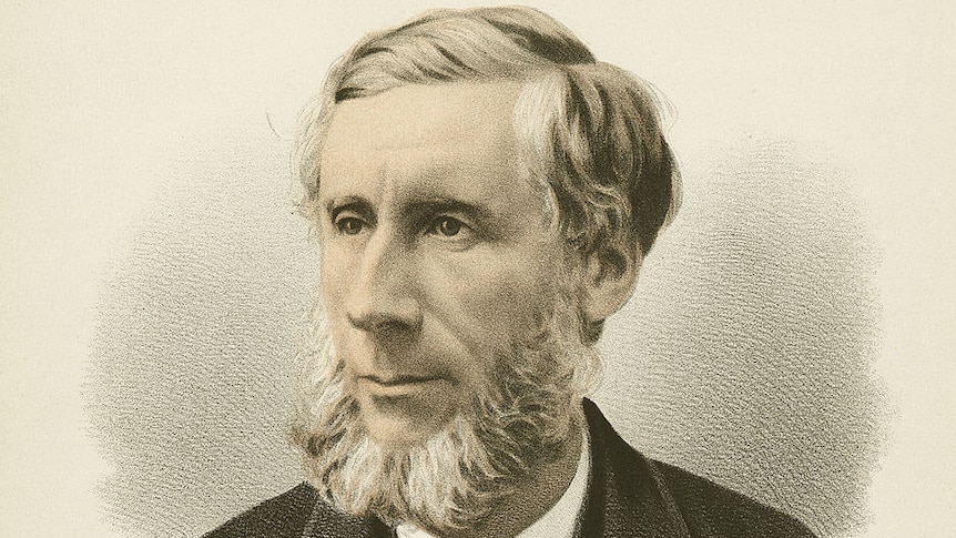 A 19th-century sepia-tinted portrait of a bearded gentleman in a suit and bow tie.