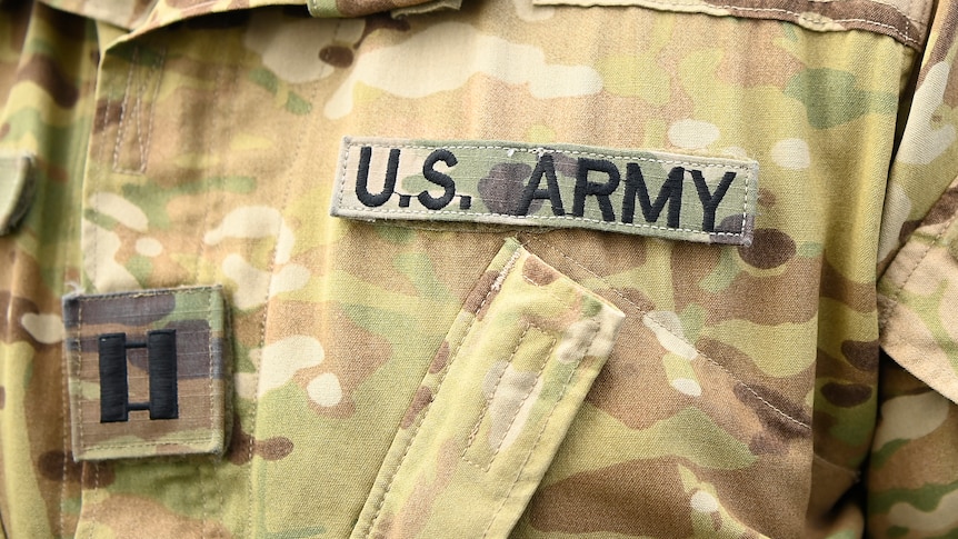 close up of US uniform on chest of soldier. Says 'US Army'