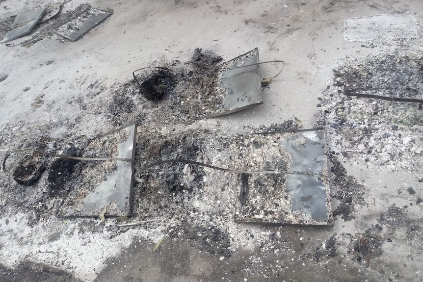 The remains of bee hives burnt in bushfires