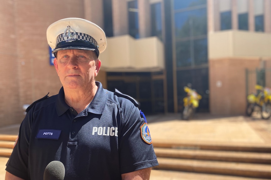 police officer standing in front of station