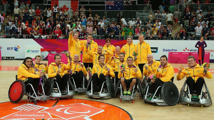 Australia's wheelchair rugby team celebrates beating Canada for a gold medal in London.