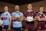 Four rugby players, 2 women and 2 men, pose in a dressing room. Two are in blue shirts and two in maroon