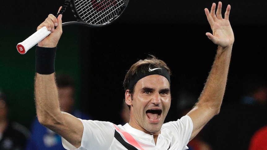 Roger Federer celebrates his sixth Australian Open title at Melbourne Park.