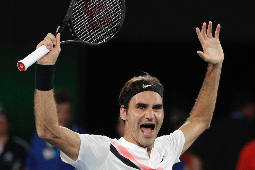 Roger Federer celebrates his sixth Australian Open title at Melbourne Park.