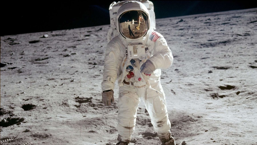 Buzz Aldrin walks on the surface of the moon during the Apollo 11 moonwalk.