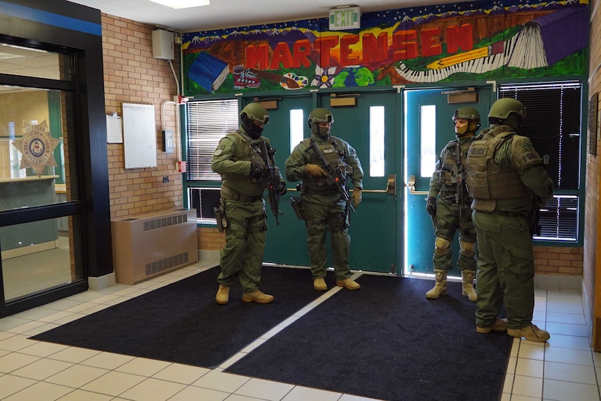 SWAT team is seen inside school.