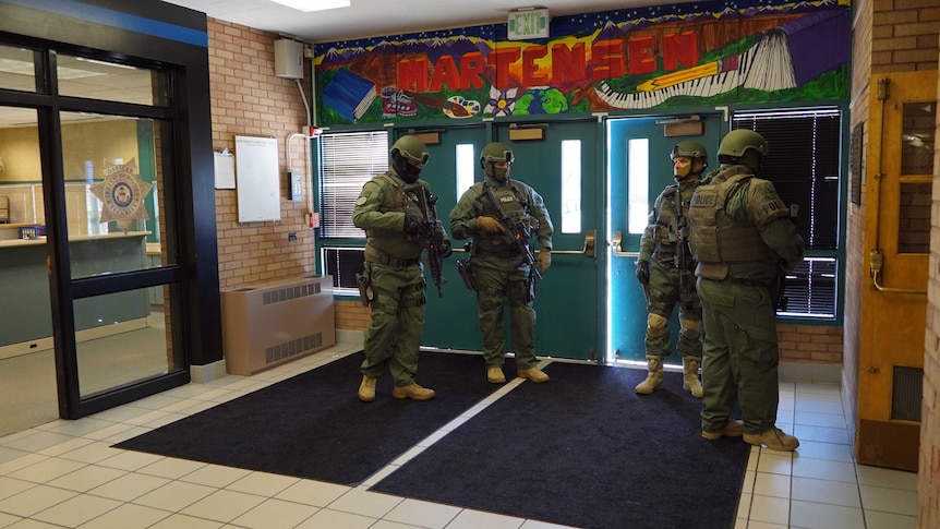 SWAT team is seen inside school.
