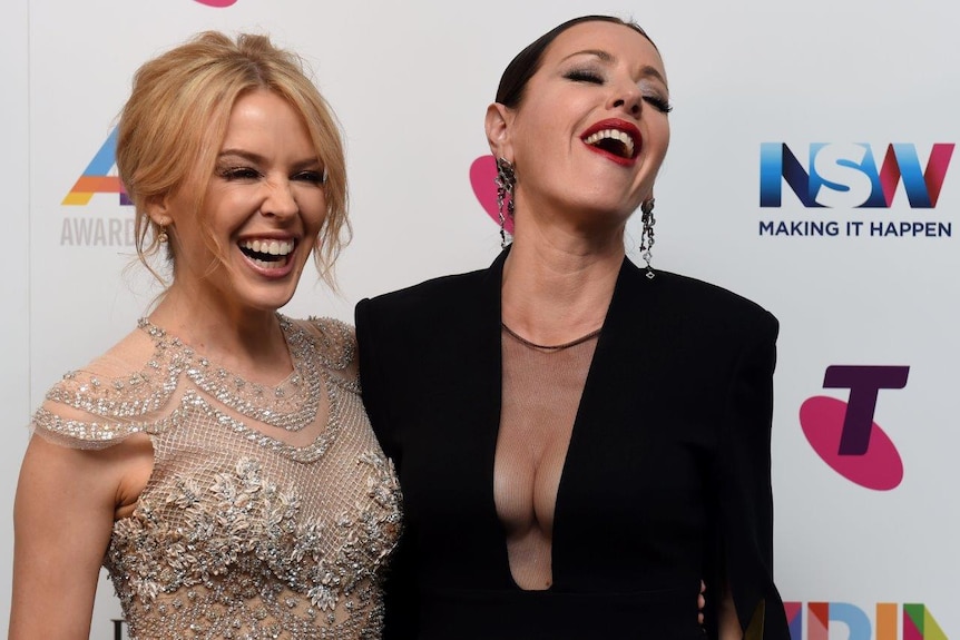 Kylie Minogue and Tina Arena pose for a photo