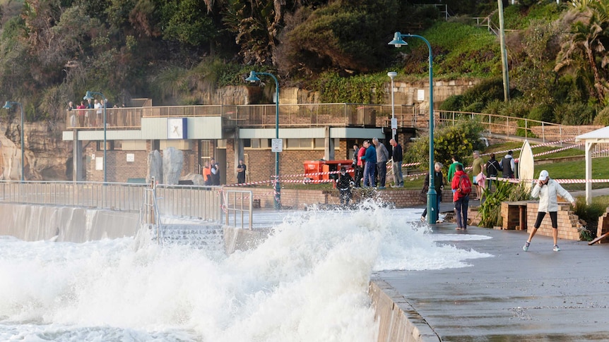 A king tide batters a walkway