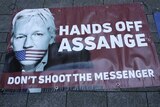 Julian Assange protest placard