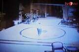 Unconfirmed CCTV footage: a suspected suicide bomber walks through a hotel in Jakarta.