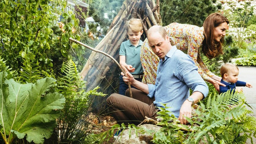 Prince William plays with children at Chelsea Flower Show