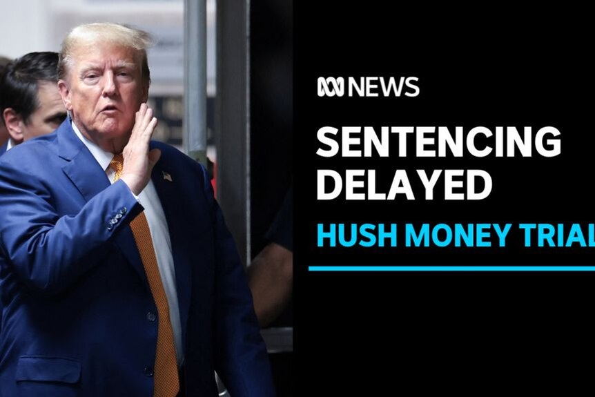 Sentencing Delayed, Hush Money Trial: Donald Trump holds up his hand to his cheek while speaking in a corridor.