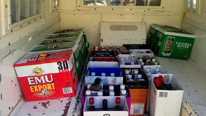 Bottles of seized black-market liquor fill the back of a police van in the Kimberley. March 10, 2014.