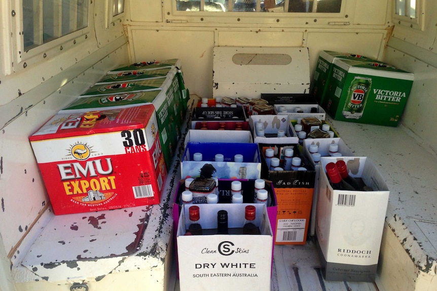 Bottles of seized black-market liquor fill the back of a police van in the Kimberley. March 10, 2014.