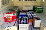 Bottles of seized black-market liquor fill the back of a police van in the Kimberley.