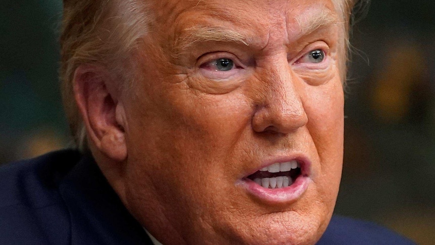 President Donald Trump speaks with reporters after participating in a video teleconference call with members of the military