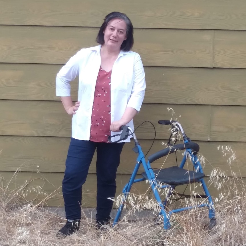 Xena standing next to her walking frame