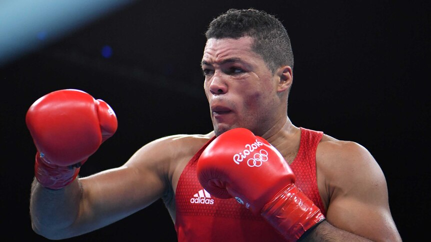 British boxer Joe Joyce holds up his fists during a fight in Rio.