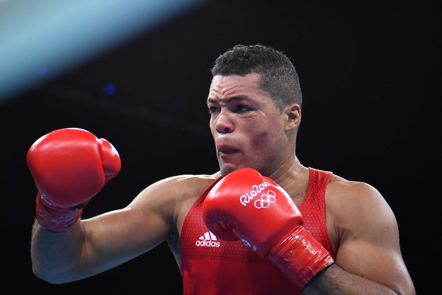 British boxer Joe Joyce holds up his fists during a fight in Rio.