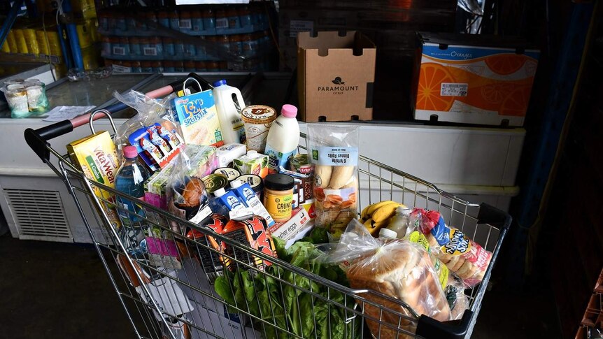 A trolley filled to the brim with food.
