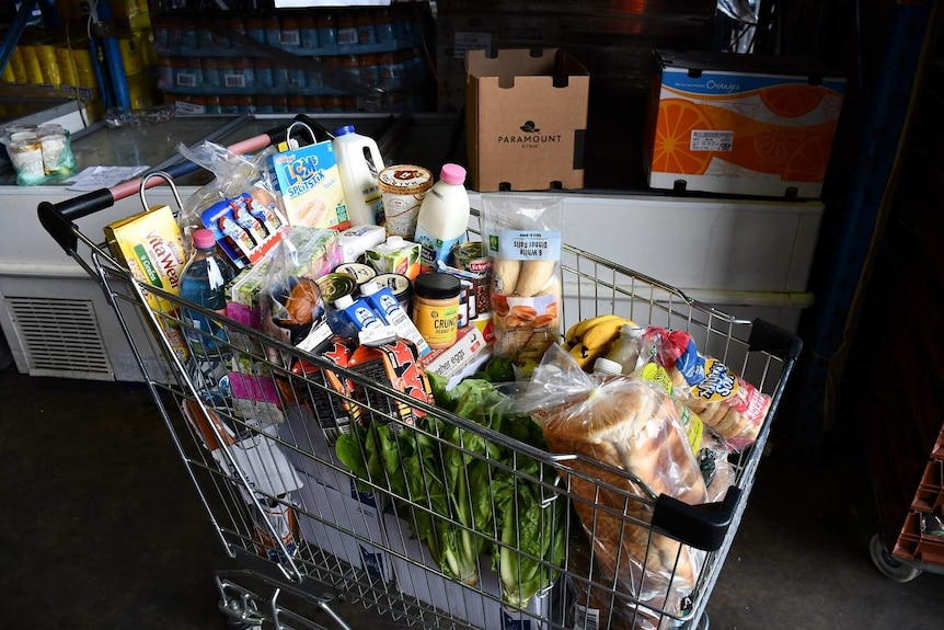 A trolley filled to the brim with food.