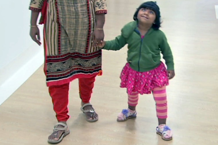 Choity walking with her mother.