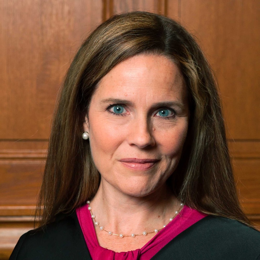 A close up of Judge Amy Coney Barrett she has blue eyes and brown hair.
