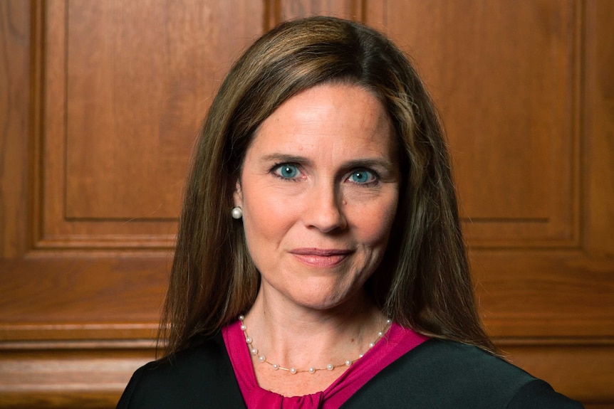 A close up of Judge Amy Coney Barrett she has blue eyes and brown hair.
