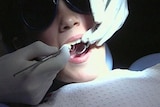 Child in a dentist chair generic