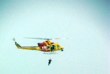 Rescue helicopter winches crewman off the Pasha Bulker